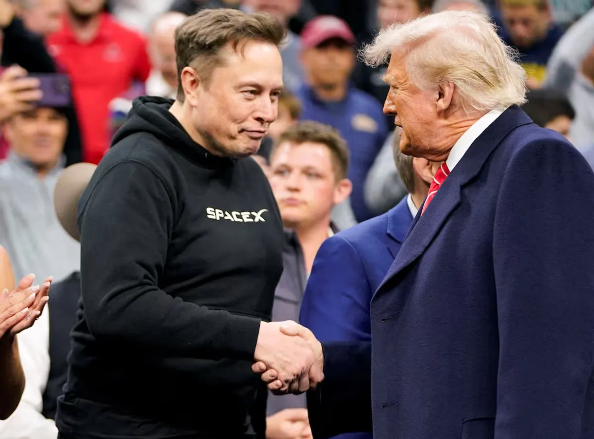 Donald Trump and Elon Musk shaking hands