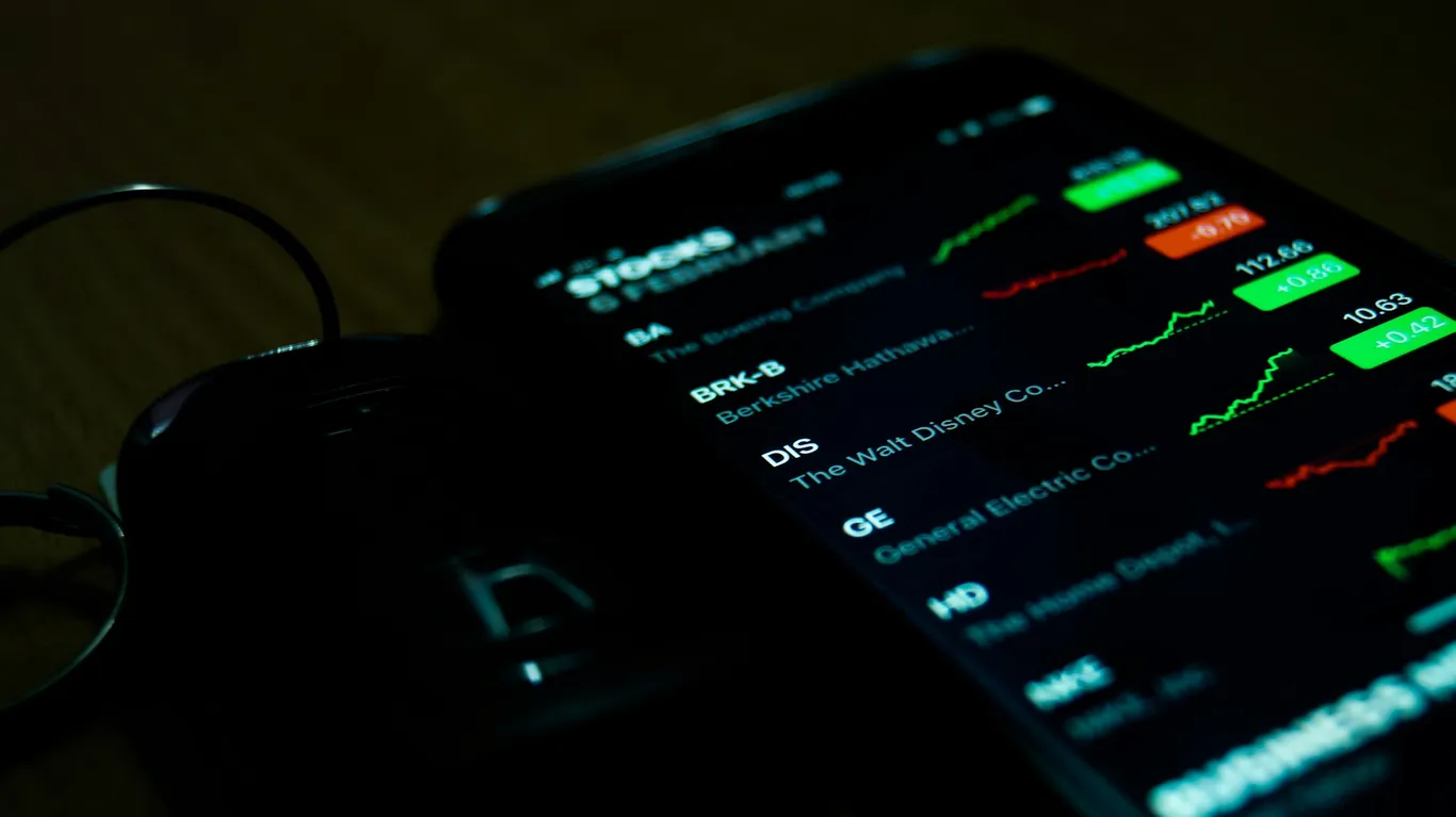 A smartphone showing charts of various stocks